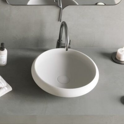 EGO Counter Vessel by Ideavit in a sleek, freestanding circular form, featuring a matte white finish and minimalist design