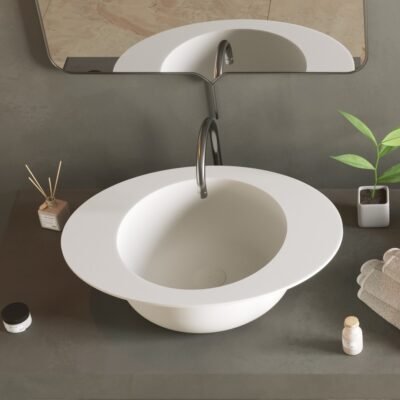 Detailed image of the CAP washbasin’s sleek round design with a unique rim feature