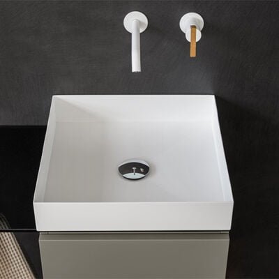 Square white solid surface freestanding washbasin with stainless steel details, adding minimalist elegance to any bathroom design