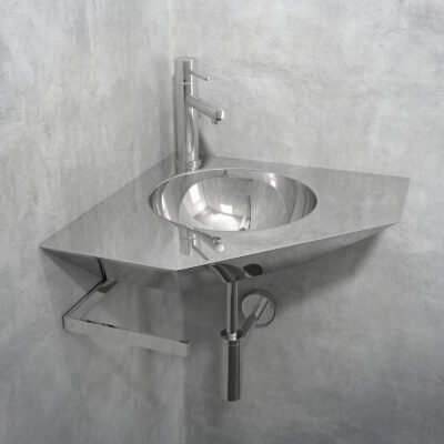 This stainless steel corner hand washbasin with an integrated round sink is perfect for space-saving bathrooms