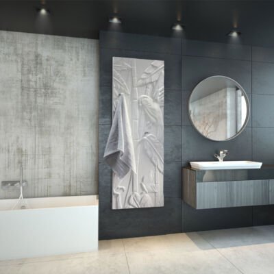 A luxurious bathroom featuring the CINIER towel warmer radiator, with warm towels draped over it