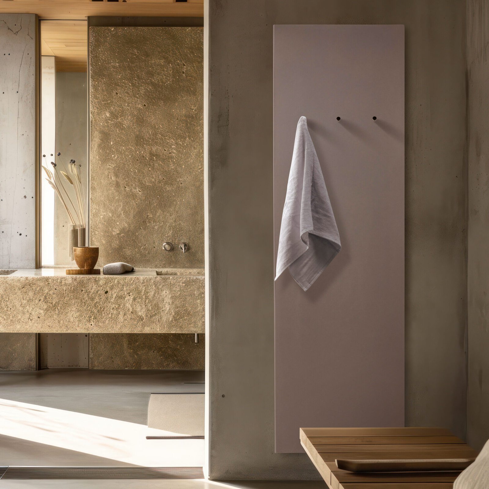 Minimal bath towel warmer radiator by Ateliers CINIER—a luxurious, energy-efficient heating solution crafted from Olycal® stone, offering quiet operation, optimal warmth, and a sleek minimalist design for modern bathrooms.