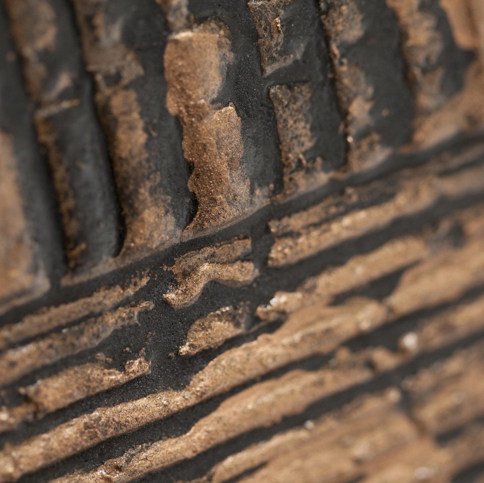 Close-up of the Granit towel warmer radiator’s natural pigments and oxides