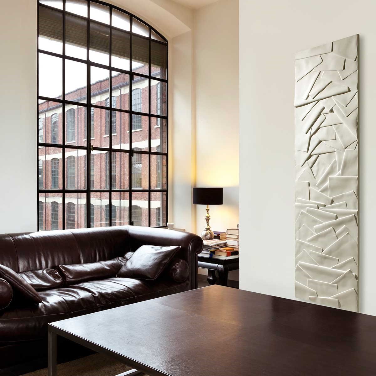 The Ateliers CINIER Edo towel warmer radiator providing a plush touch to a bathroom, ideal for warming towels