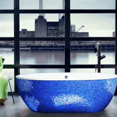 Sleek bathtub with a glossy white finish interior and exquisite Sicis blue leaf mosaic exterior