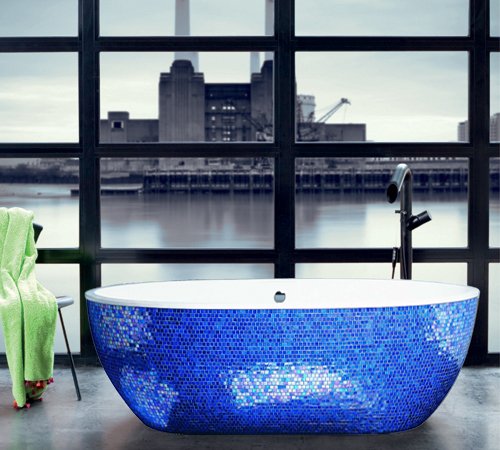 Sleek bathtub with a glossy white finish interior and exquisite Sicis blue leaf mosaic exterior