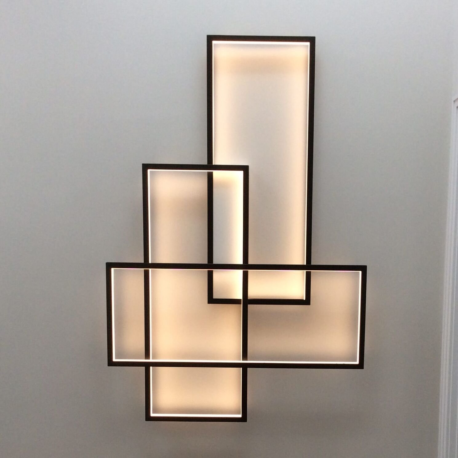 Sleek Trio LED Light Fixture by CINIER Sleek Trio LED Light Fixture by CINIER, featuring a modern design with three customizable LED frames in a white finish