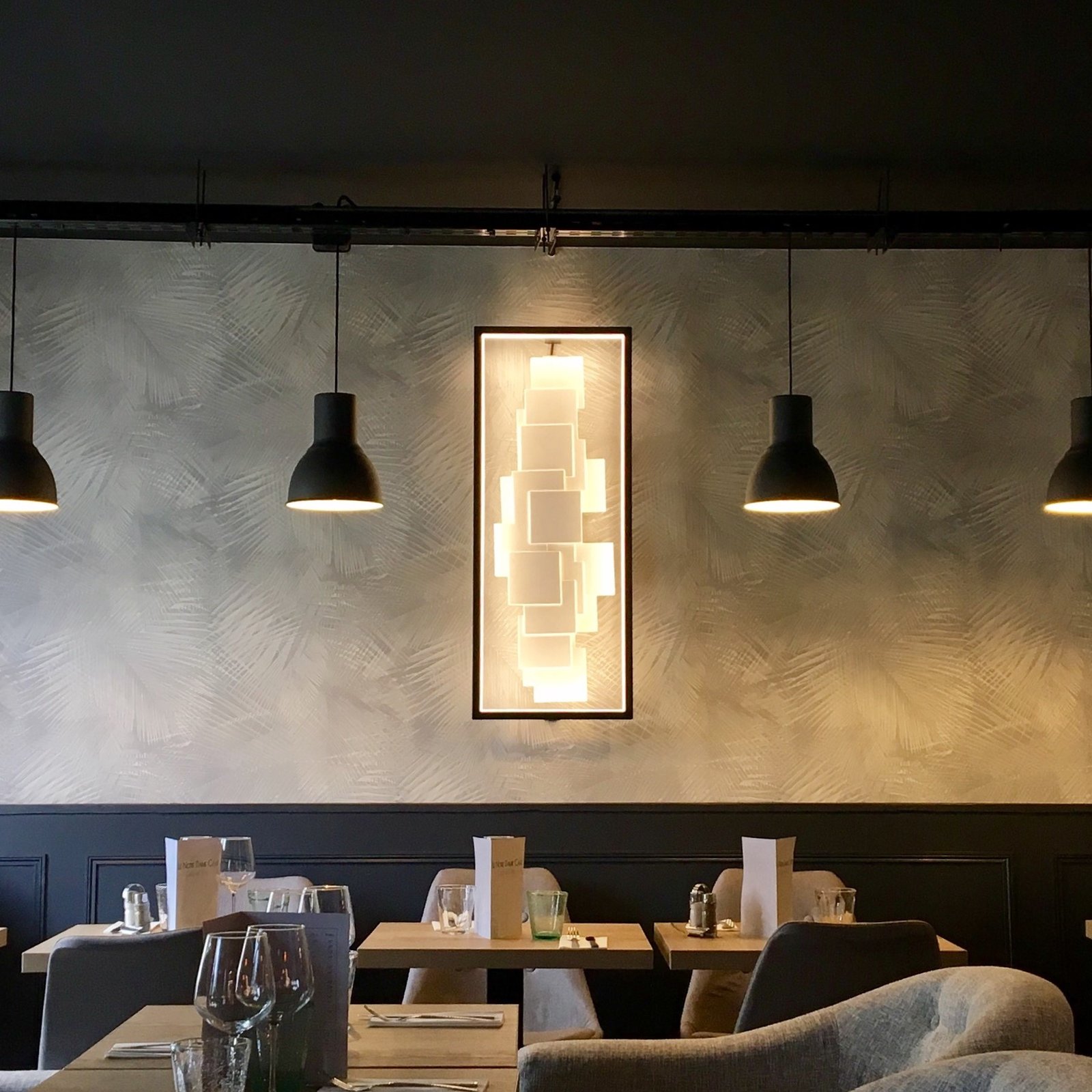 Close-up of the CINIER LT Sculptural LED light fixture, showcasing its intricate craftsmanship and energy-efficient lighting technology