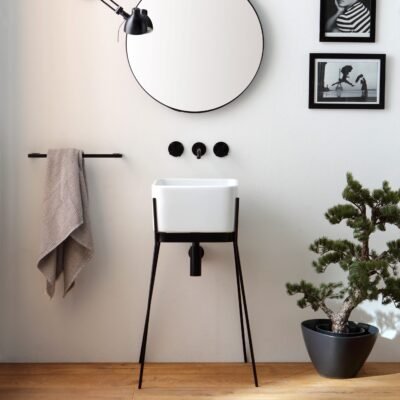 IBRIDO Square Pedestal Sink with glossy white ceramic basin and sleek black metal pedestal