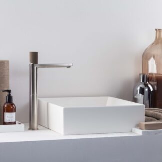 The HAPTIC premium bathroom tap by Ritmonio combines ergonomic design with elegant finishes like polished chrome, matte black, and satin nickel