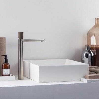 The HAPTIC premium bathroom tap by Ritmonio combines ergonomic design with elegant finishes like polished chrome, matte black, and satin nickel