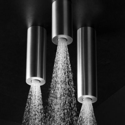 Trio of ceiling-mounted tubular rainfall shower heads in premium stainless steel, available in 4", 6", and 8" heights, featuring sleek 2" diameters and various finishes