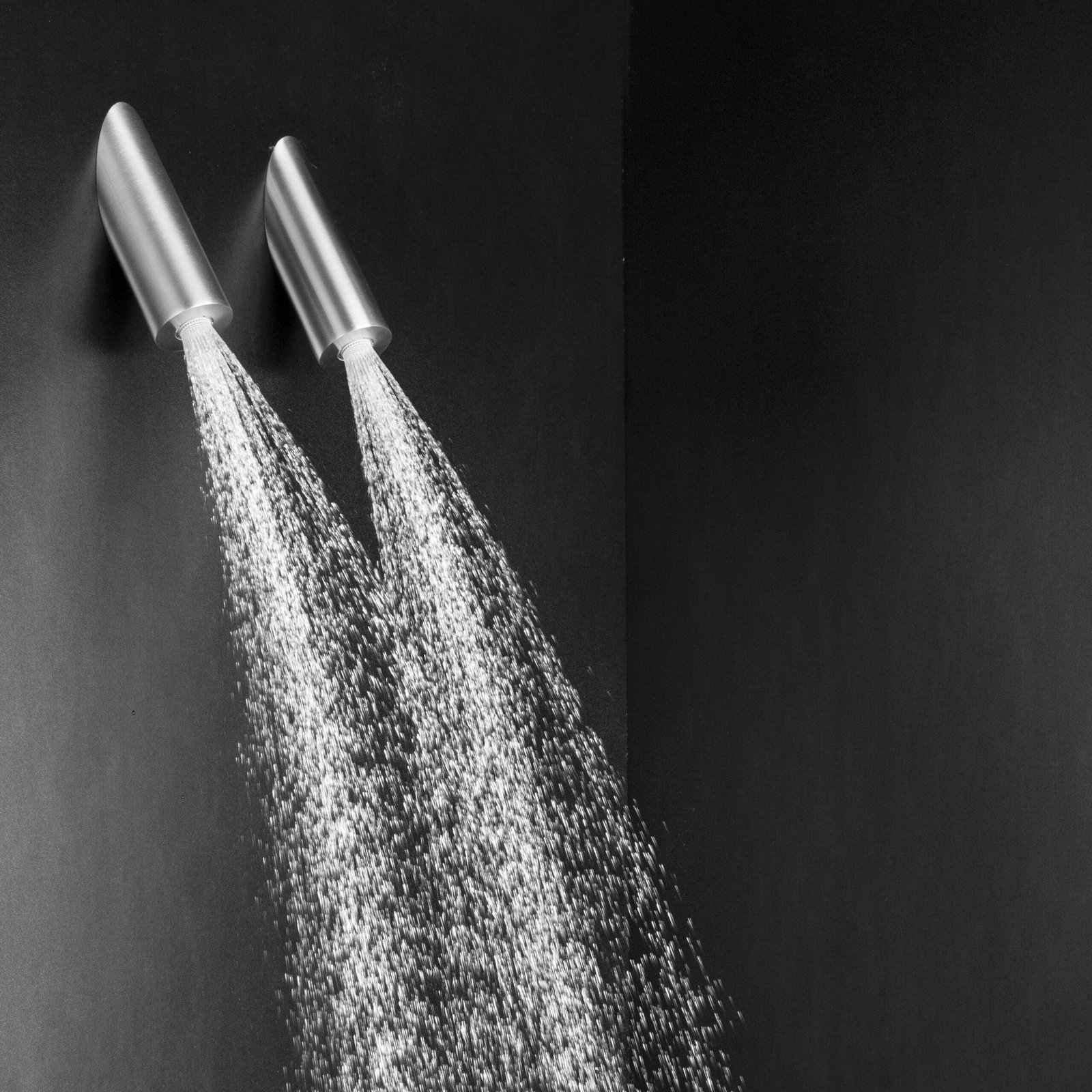 Set of modern ceiling-mounted tube shower heads with a slim 2" diameter and polished finishes