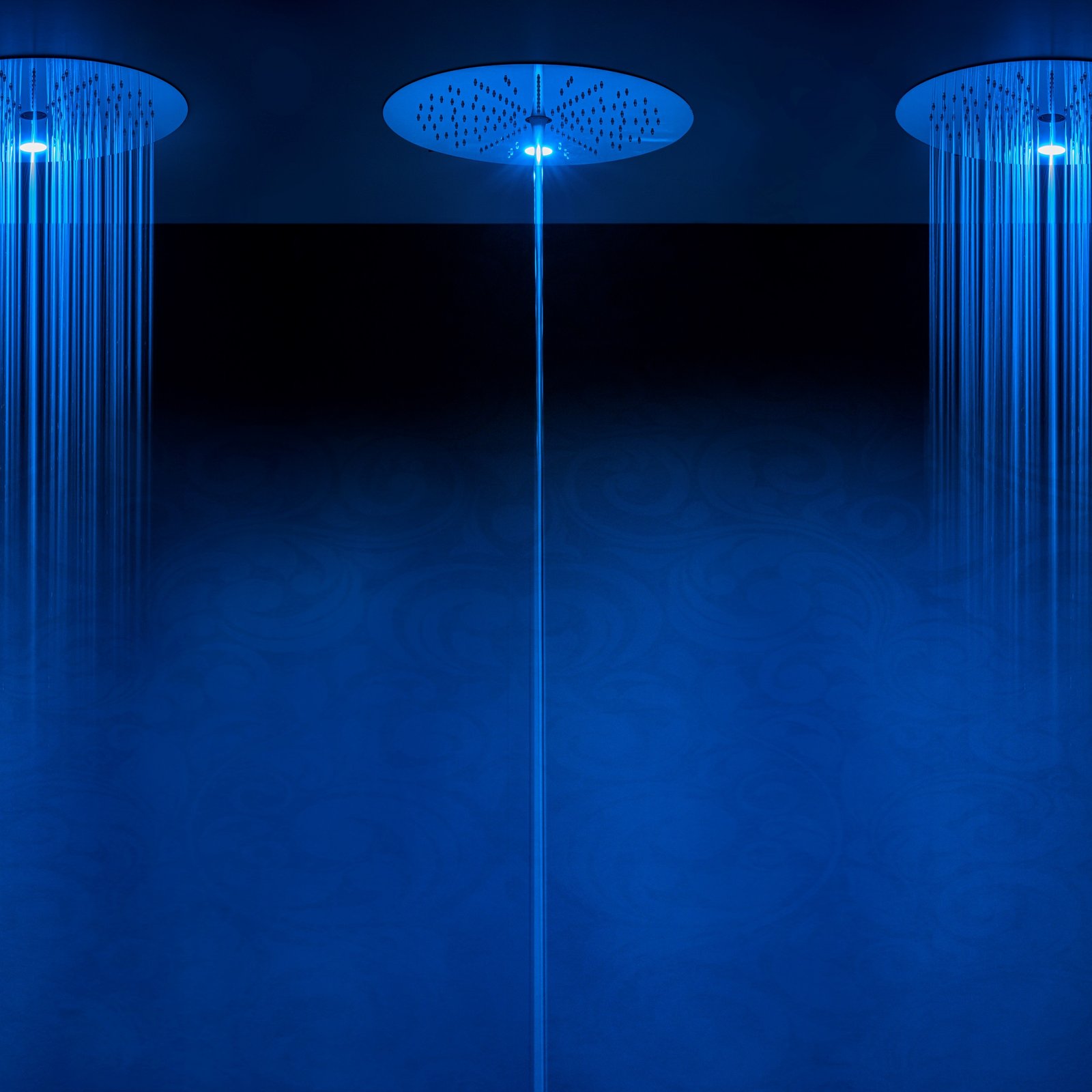 Rain Therapy shower head with tub filler and chromotherapy lights, offering a spa-like experience