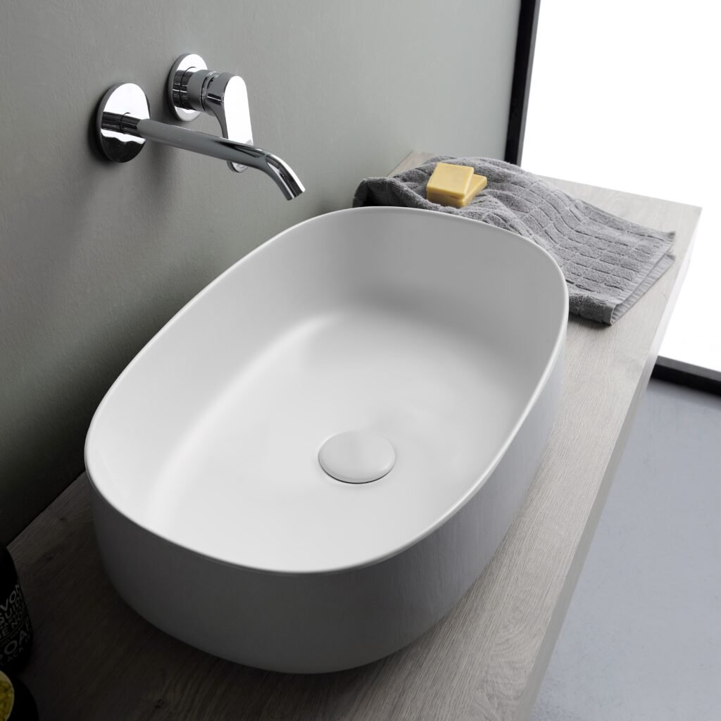 Oval ceramic washbasin by Horganica, combining unique designs and eco-friendly materials