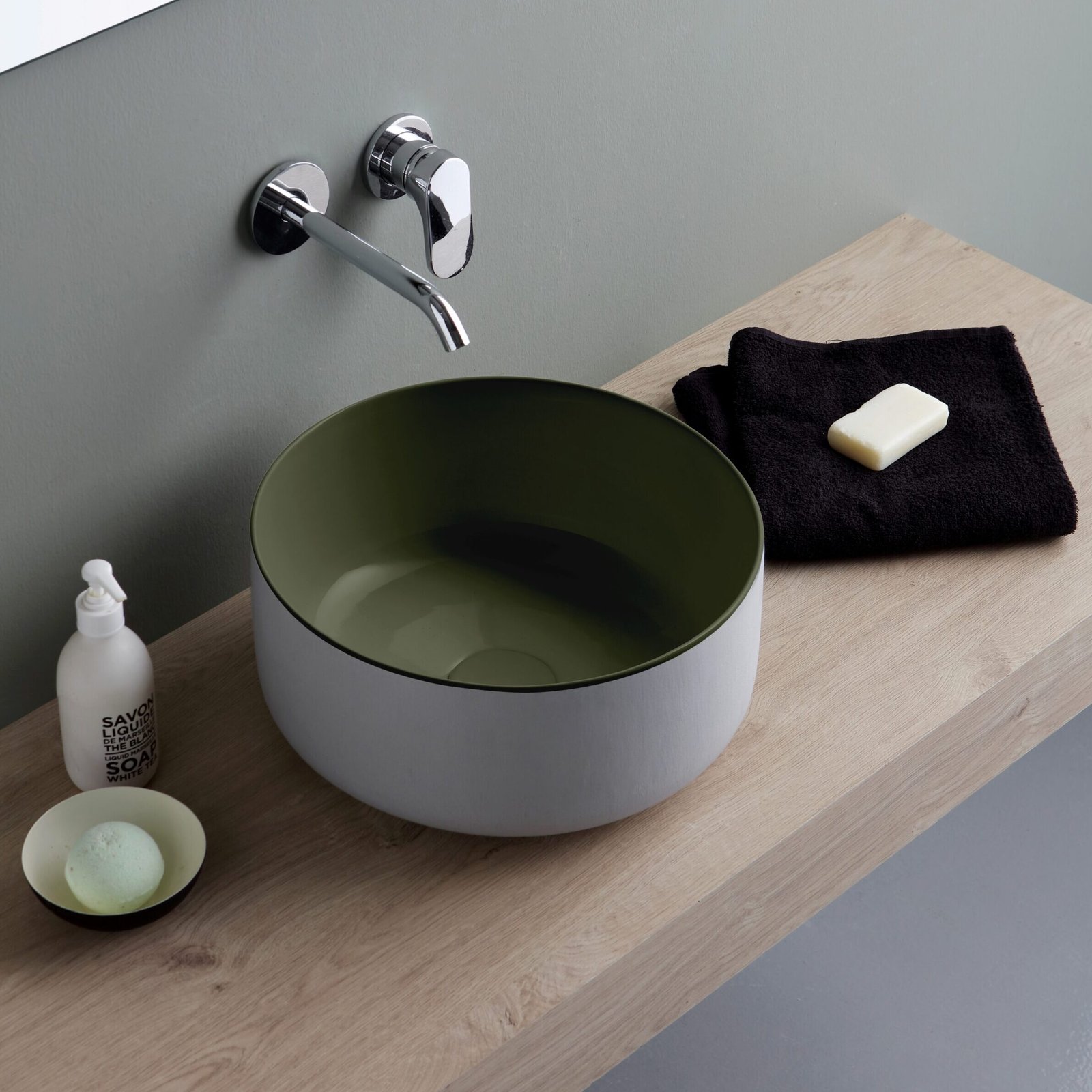 Compact round ceramic washbasin Compact round ceramic washbasin, ideal for minimalist bathrooms