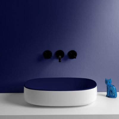 Sleek bicolor oval ceramic washbasin from the Horganica Collection, showcasing innovative materials and a striking finish