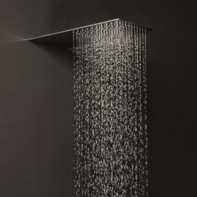Sleek 20″ x 9″ rectangular stainless steel wall-mounted rainfall shower head with 99 limescale-resistant nozzles