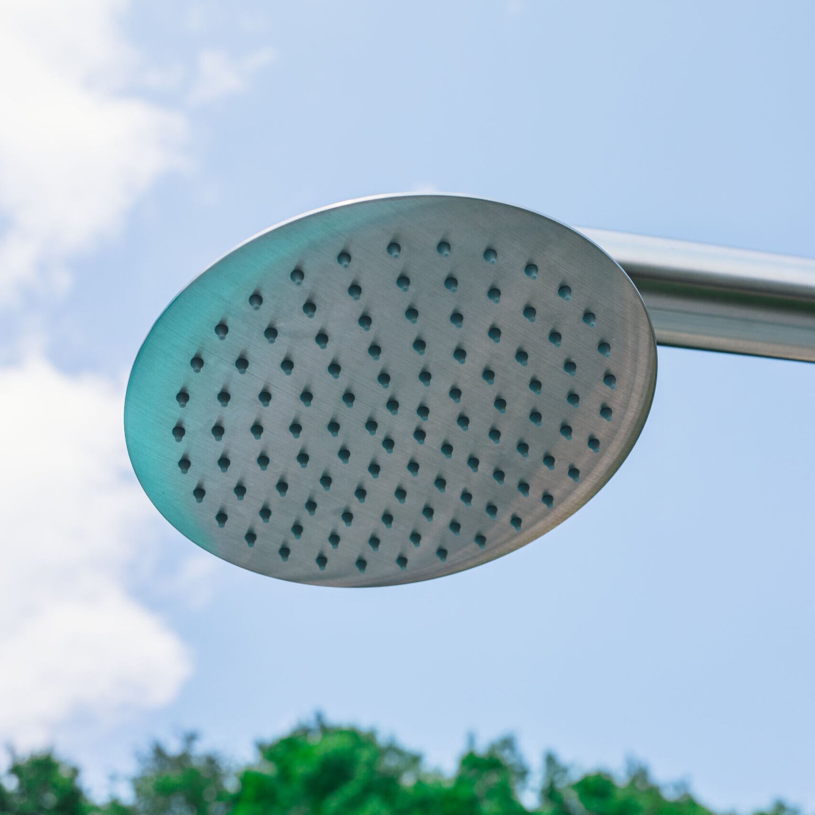 Sophisticated outdoor shower column offering dual shower options with a rain head and hand shower