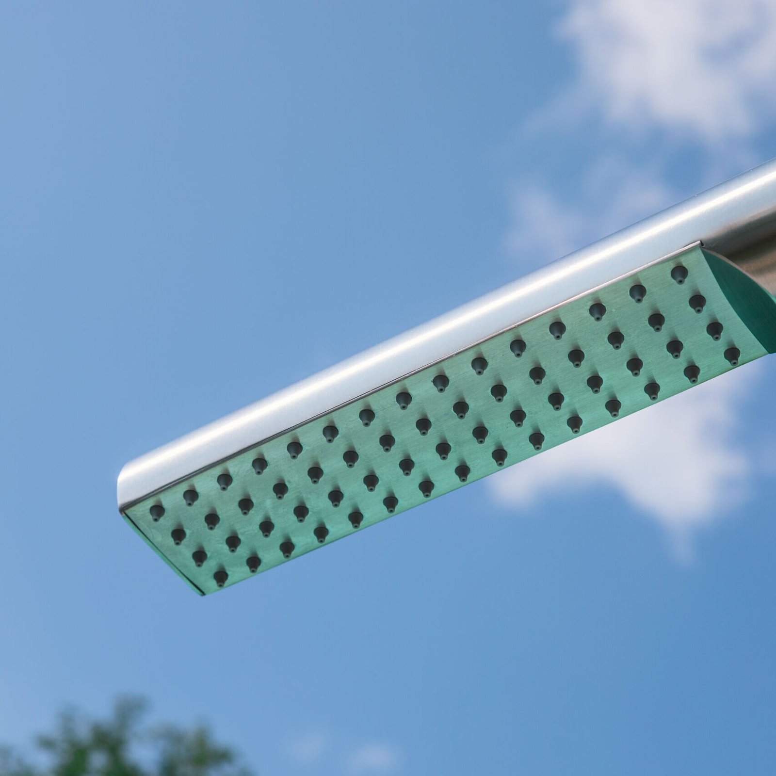 Elegant outdoor shower column made from 316 stainless steel, ideal for gardens or poolside areas