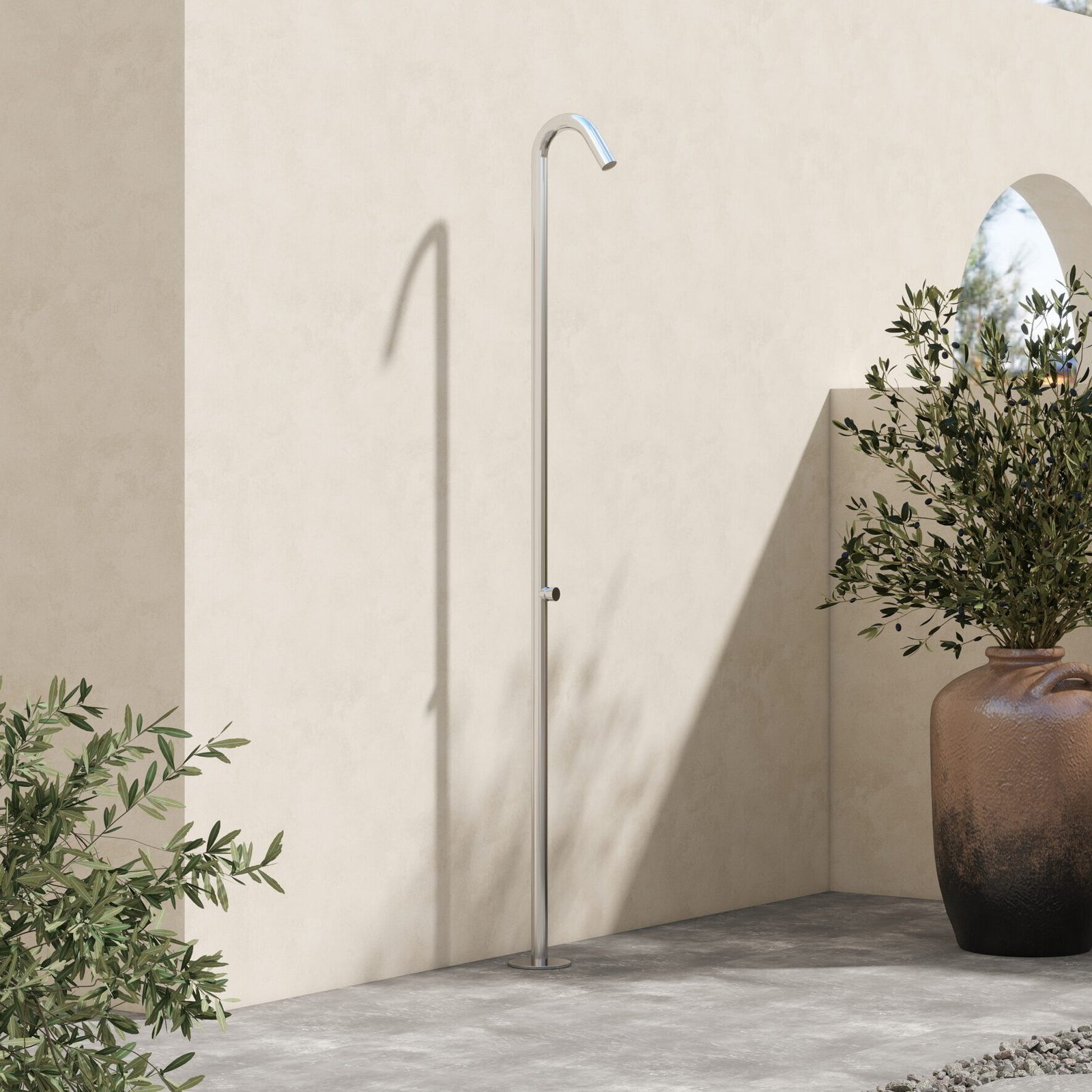 Minimalist time-controlled outdoor shower made of marine-grade stainless steel with 15-second cold water flow.
