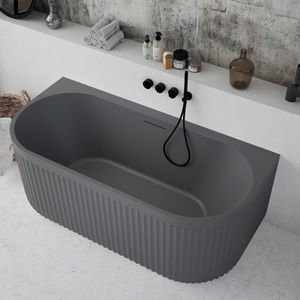 Modern grey bathtub installed against the wall, showcasing a minimalist Rock Texture finish.