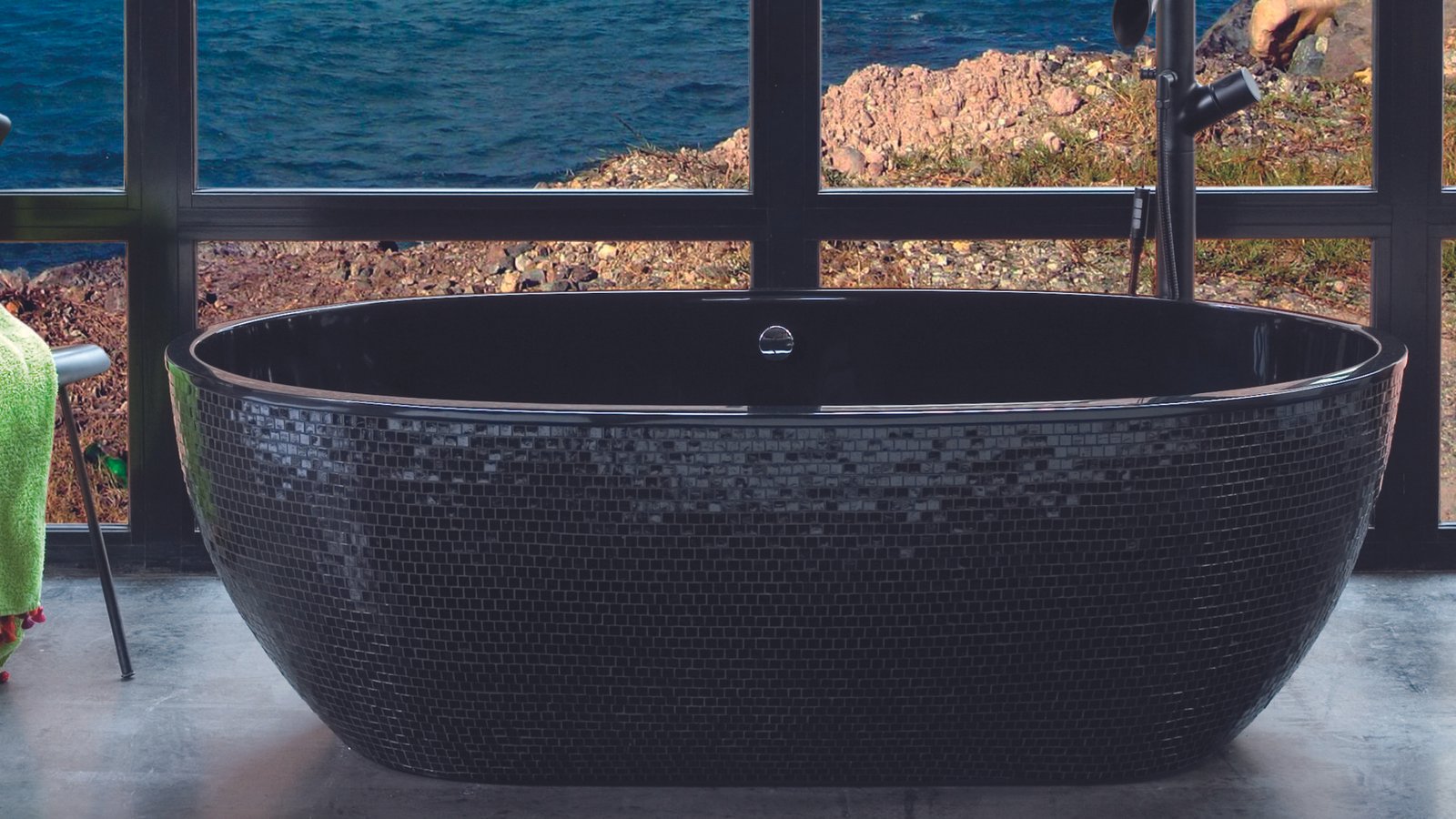 Sleek STONE1 bathtub with a glossy black finish interior and exquisite black mosaic exterior